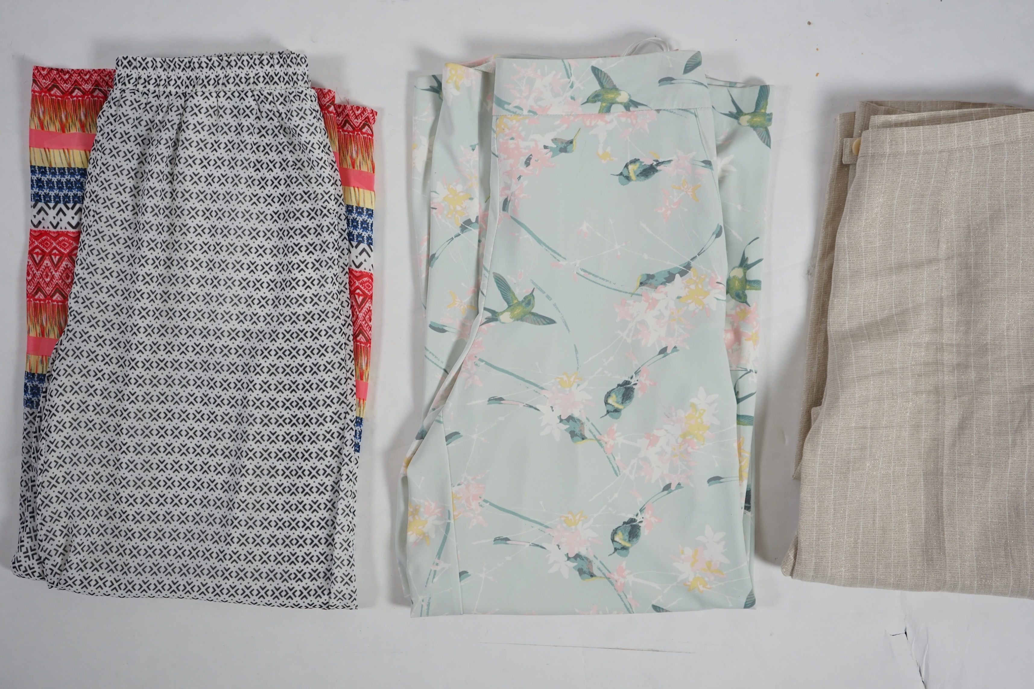 Three pairs of lady's casual trousers. Approx size 14-16 Proceeds to Happy Paws Puppy Rescue